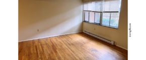 Unfurnished living room with hardwood floor
