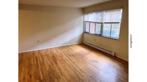 Unfurnished living room with hardwood floor