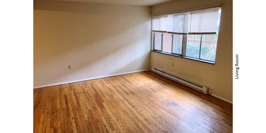 Unfurnished living room with hardwood floor