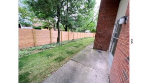 Concrete patio and small yard
