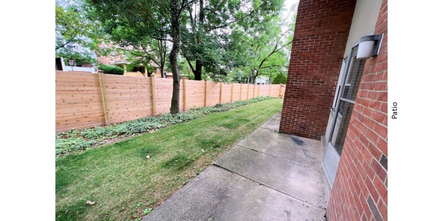 Concrete patio and small yard