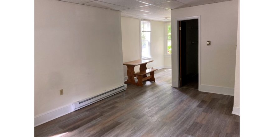 Bedroom with large windows and desk