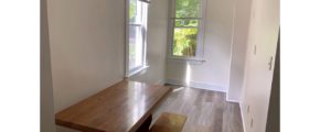 Bedroom with large windows and desk