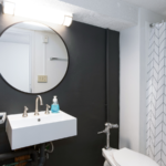 Bathroom with sink, mirror, toilet and shower