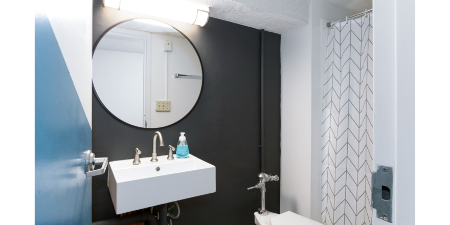 Bathroom with sink, mirror, toilet and shower