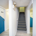 Hallway with stairway and doors