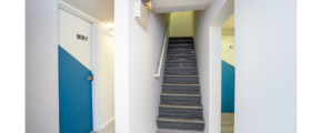 Hallway with stairway and doors