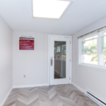 Entryway with laminate floor and door