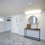First floor hallway with decorations and mirror