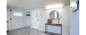 First floor hallway with decorations and mirror