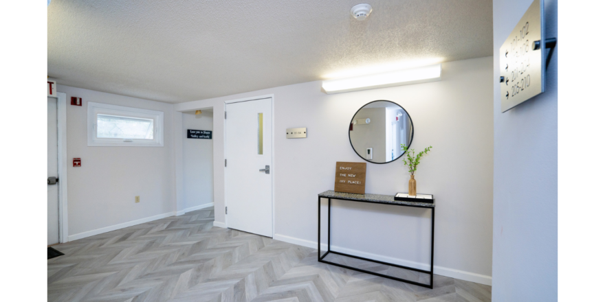 First floor hallway with decorations and mirror