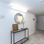 First floor hallway with decorations and mirror