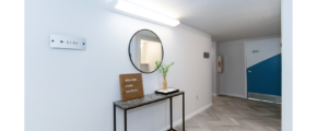 First floor hallway with decorations and mirror