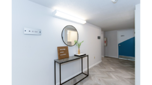 First floor hallway with decorations and mirror