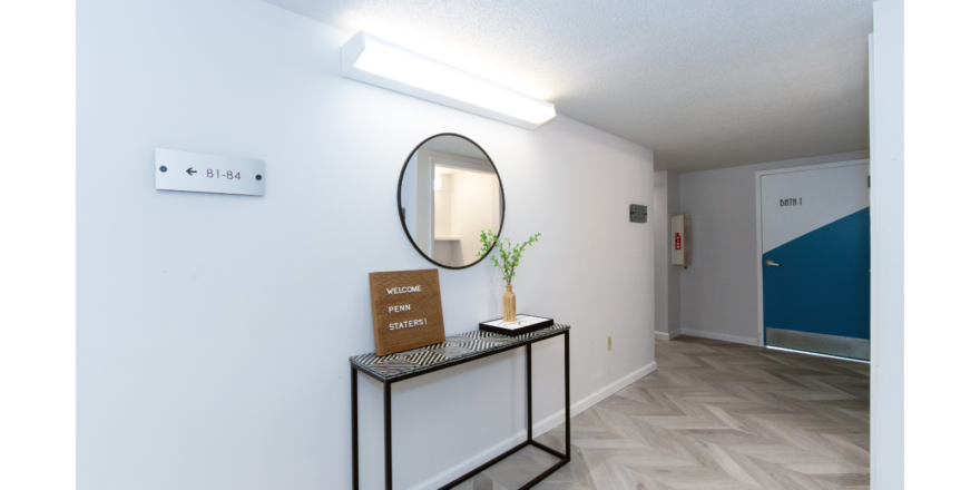 First floor hallway with decorations and mirror