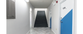 Hallway with stairway and doors