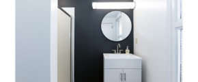 Bathroom with vanity, mirror, and shower stall