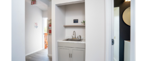 Hallway with sink and shelf