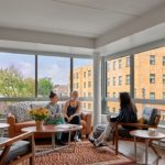Friends hanging out in an apartment living room