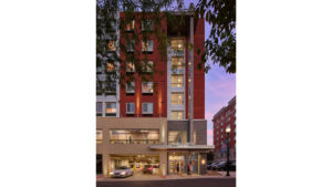 Nighttime exterior photo of apartment building Pugh Centre