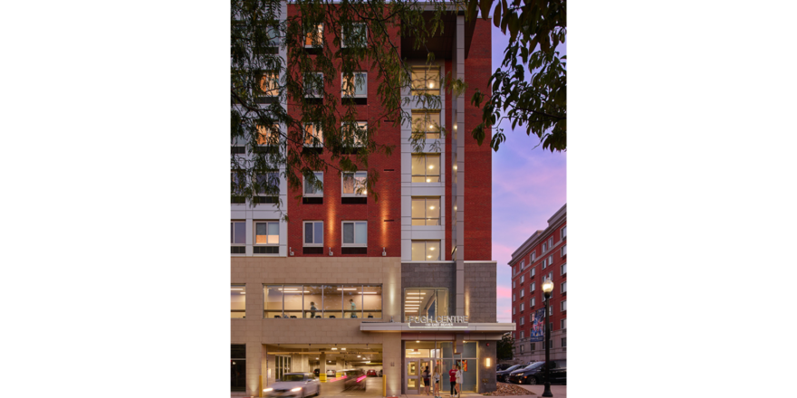 Nighttime exterior photo of apartment building Pugh Centre