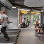 Young adults working out in a fitness center