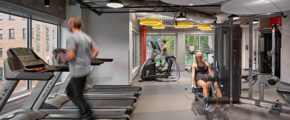 Young adults working out in a fitness center