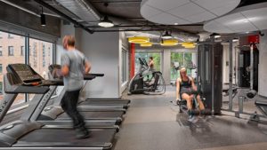 Young adults working out in a fitness center