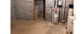 Unfinished basement with sink and water heater