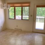 Dining room with door to deck and chandelier