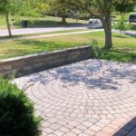 Front patio with pavers in a circular pattern in the middle