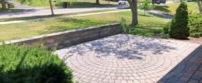 Front patio with pavers in a circular pattern in the middle