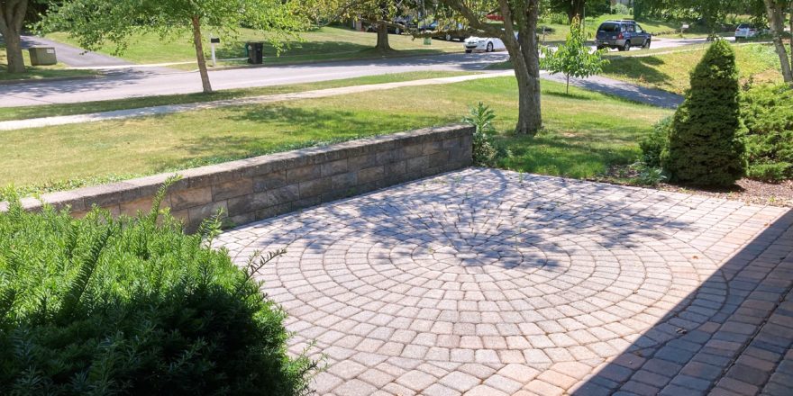 Front patio with pavers in a circular pattern in the middle