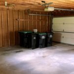 Garage with garbage and recycling bins