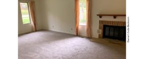 Owner's suite bedroom with gas fireplace and large windows