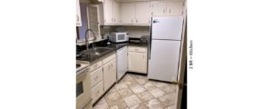 Kitchen with white cabinets and white appliances