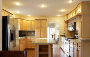 a kitchen with wooden cabinets and white appliances