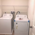 a washer and dryer in a small room