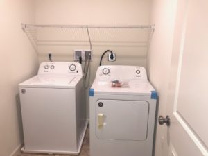 a washer and dryer in a small room