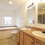 a bathroom with a sink, toilet and bathtub
