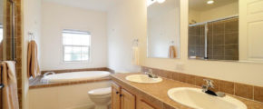 a bathroom with a sink, toilet and bathtub