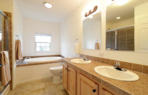 a bathroom with a sink, toilet and bathtub