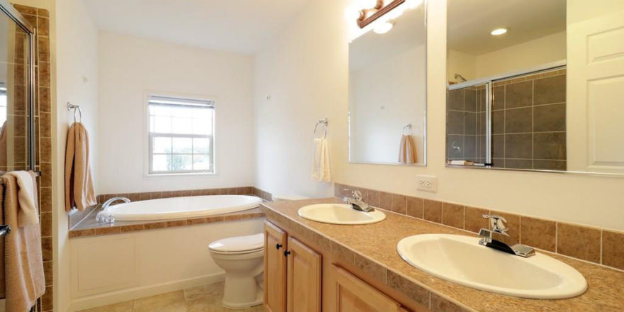 a bathroom with a sink, toilet and bathtub