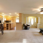 an empty living room and dining room in a house