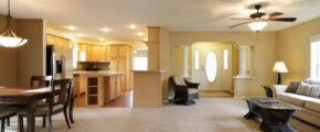 an empty living room and dining room in a house