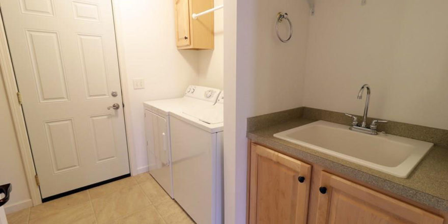 a washer and dryer in a small room