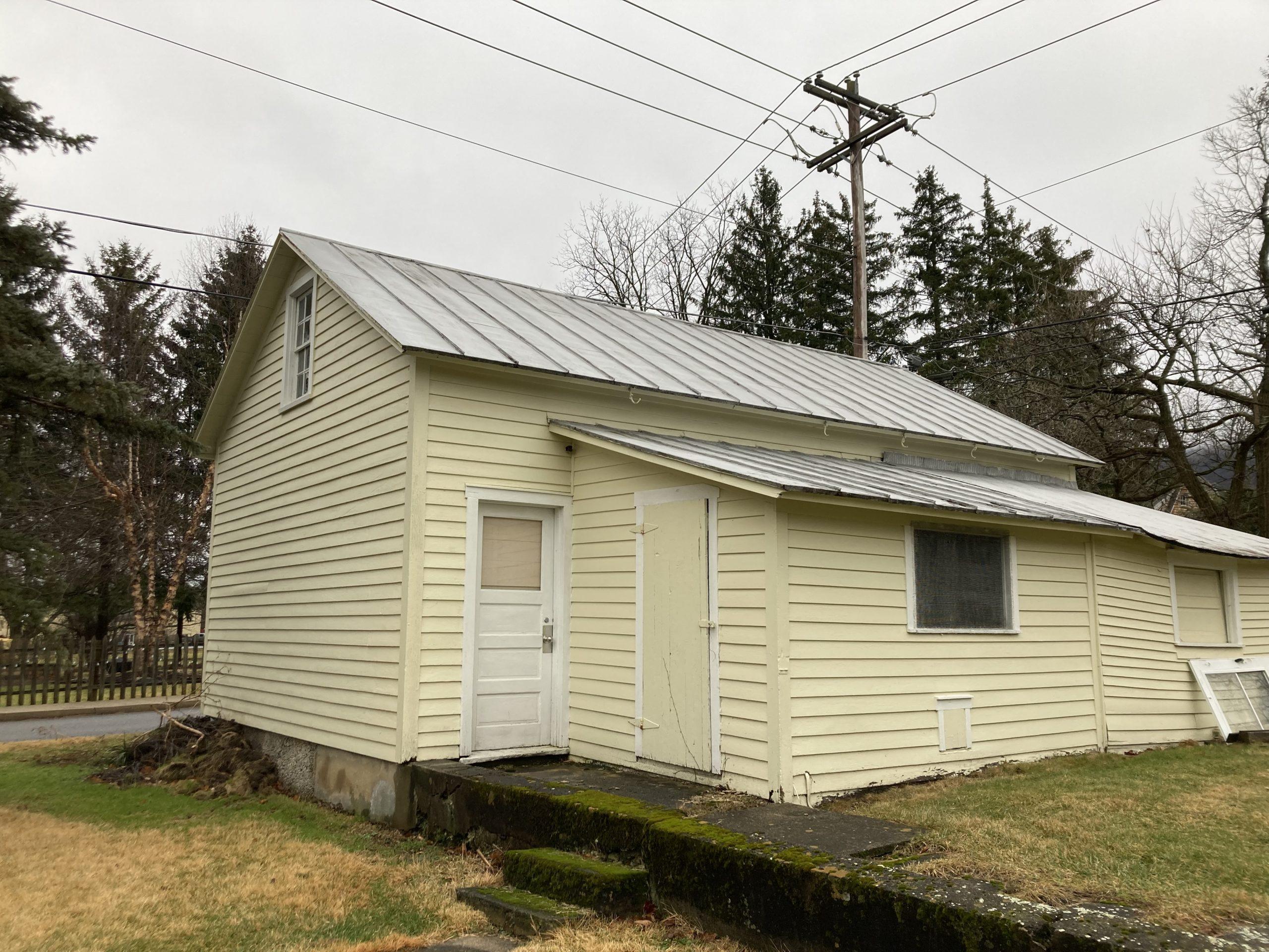 Yellow building with metal roof