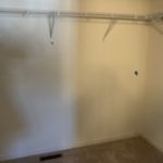 a closet and white walls