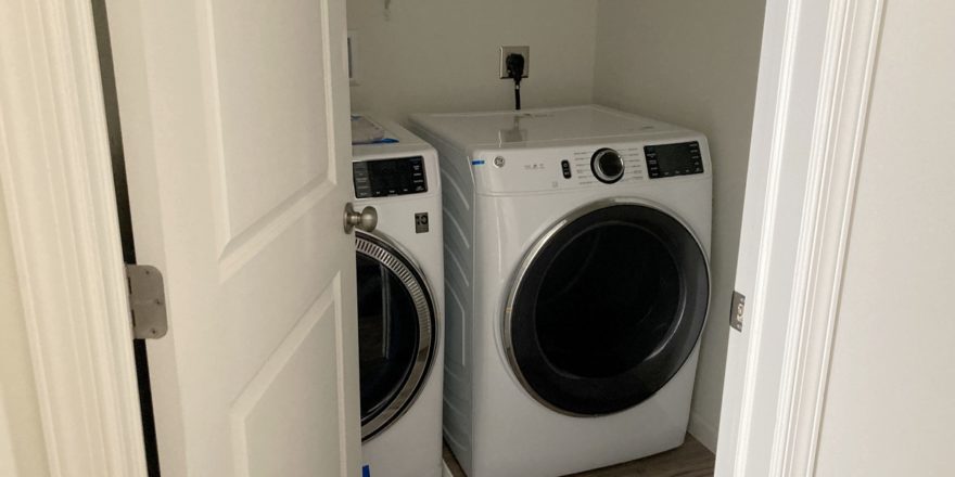 a washer and dryer in a closet