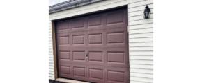 a garage door with a light on the side